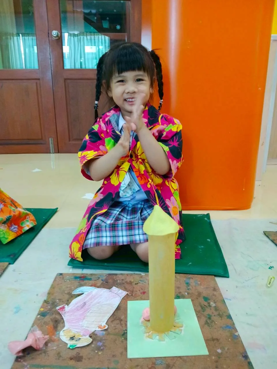 Child painting on the floor