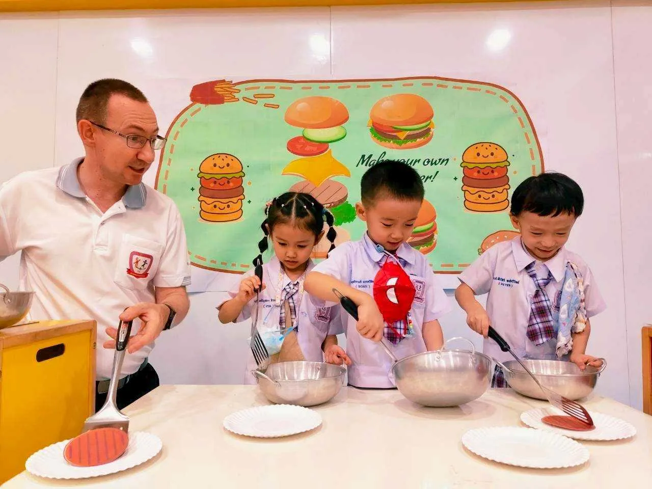 Children in a make-your-own-burger cooking activity