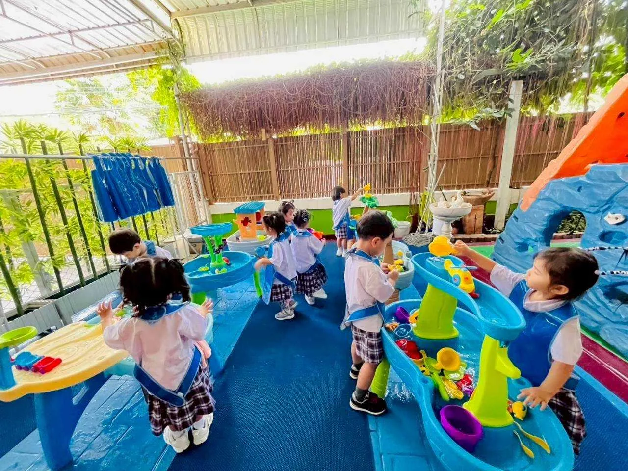 Children at a colourful sensory water-play activity