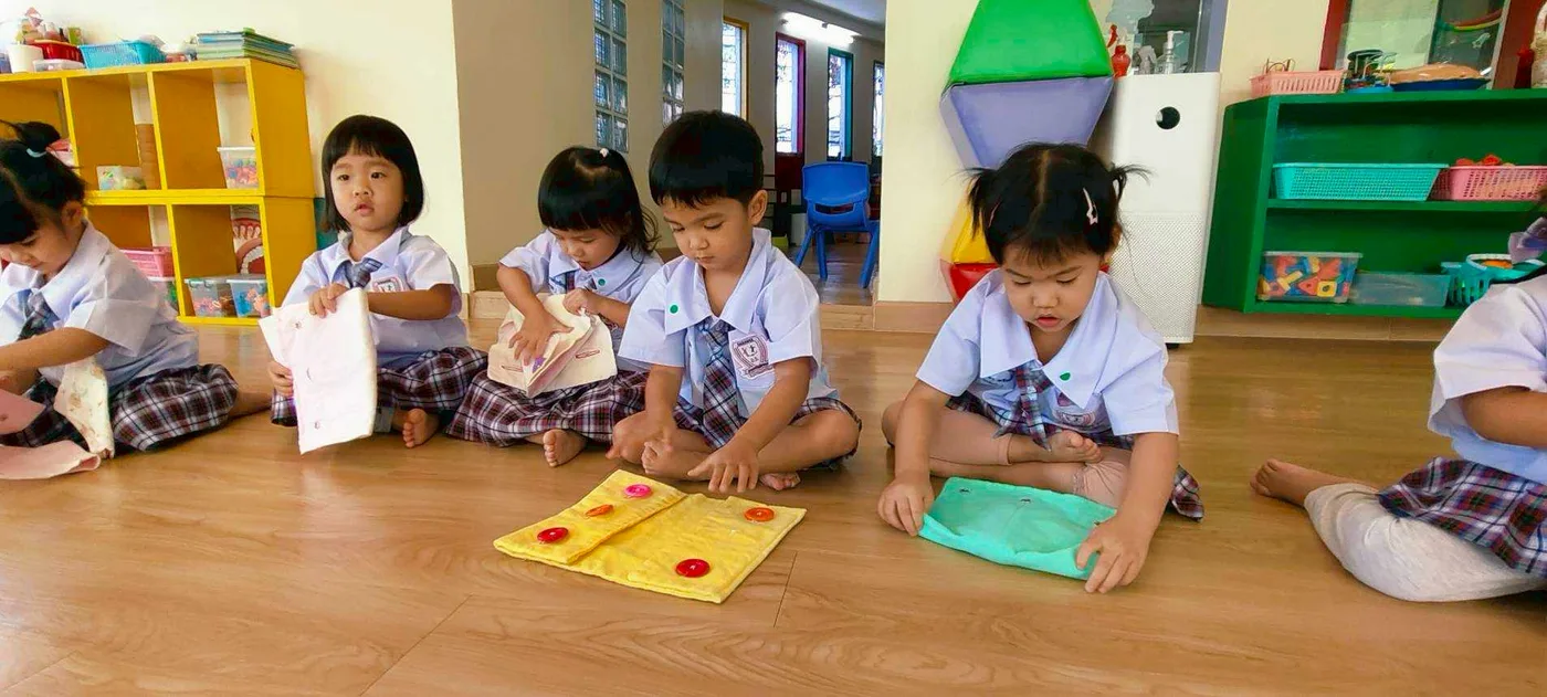 Children in a hands-on Montessori sorting activity